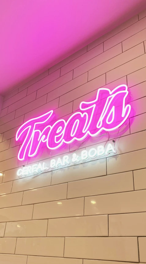 the sign for a restaurant that says treats