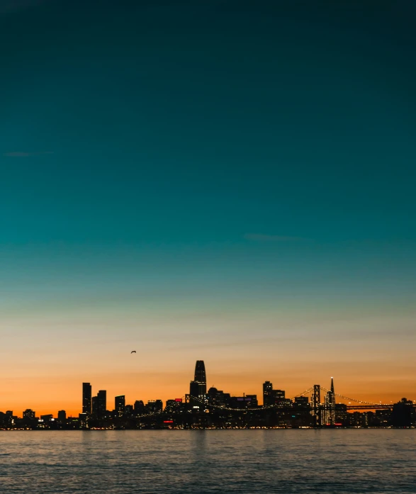 a bright yellow sunset over a large city