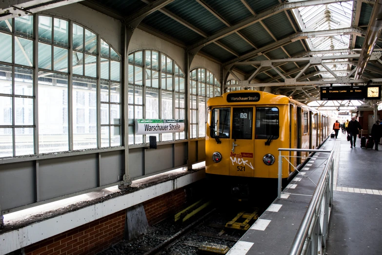 a subway train stopped at the station with passengers