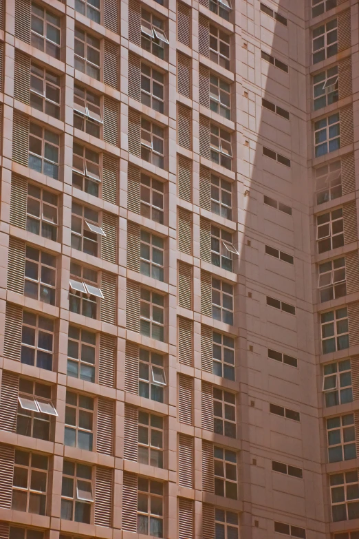 a building with many windows and light in front