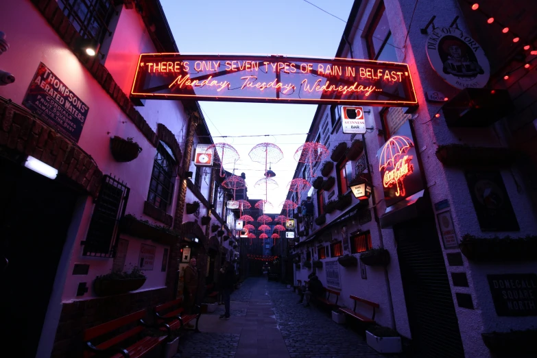 a street with various seating area in the alley