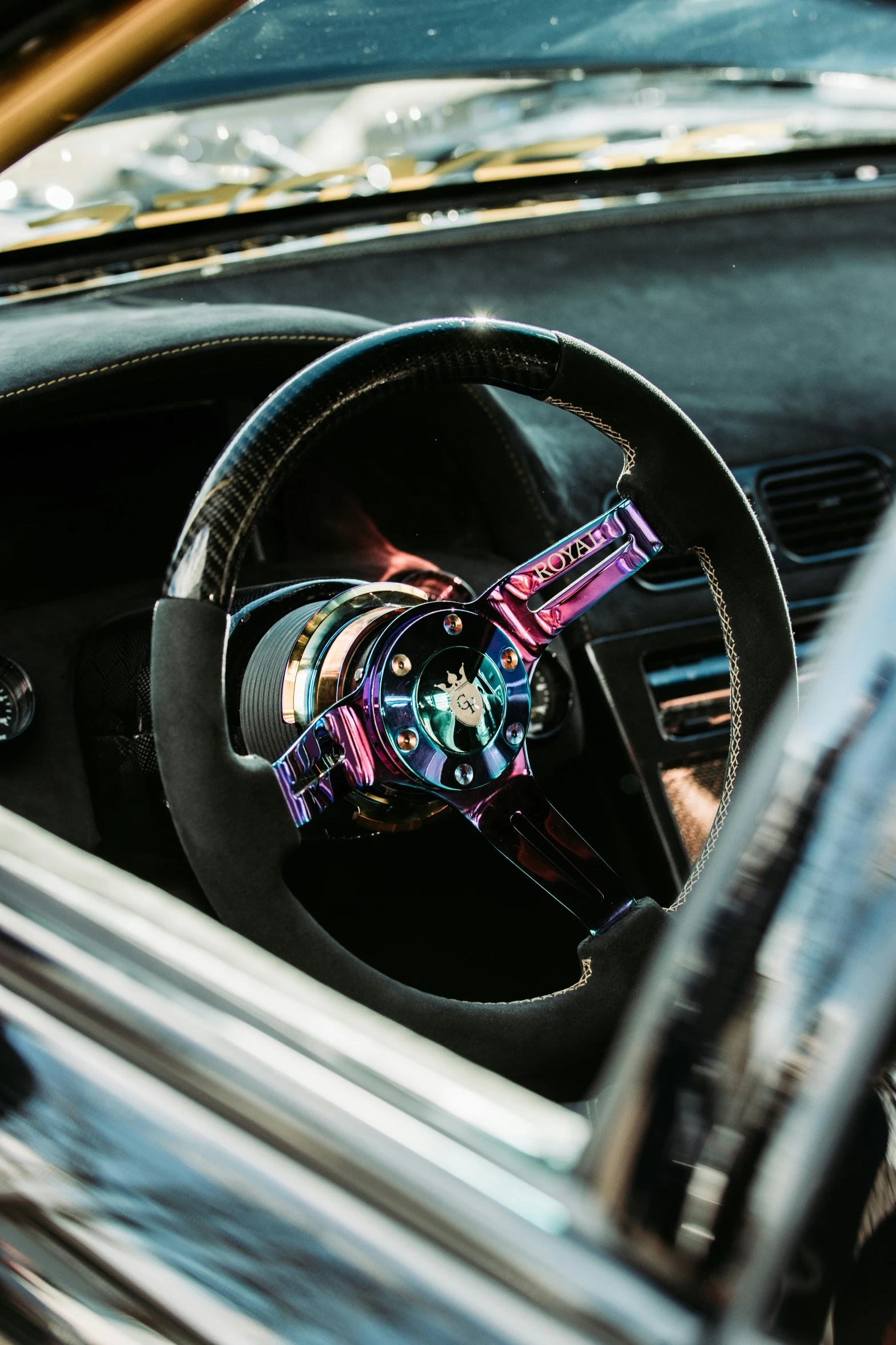 a steering wheel and the interior of a car