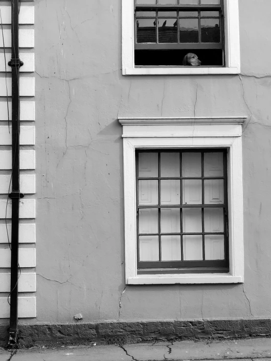 an open window is shown next to the side of a building