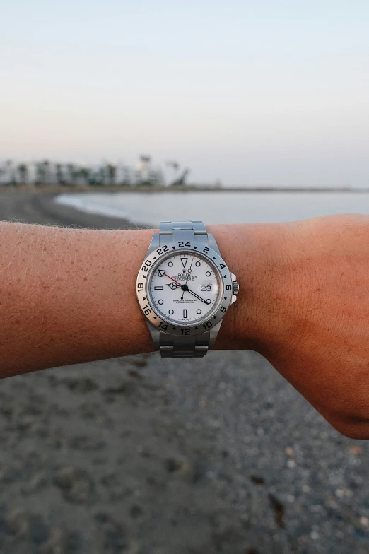 a person's wrist is shown with a watch on it