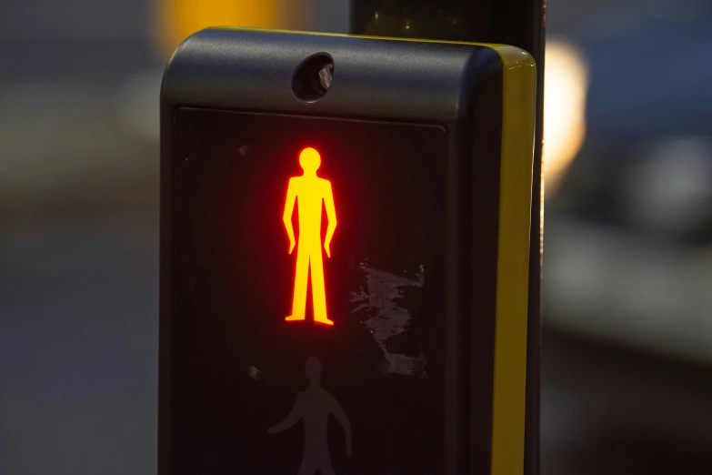a traffic light displaying a male figure on the left and right of it