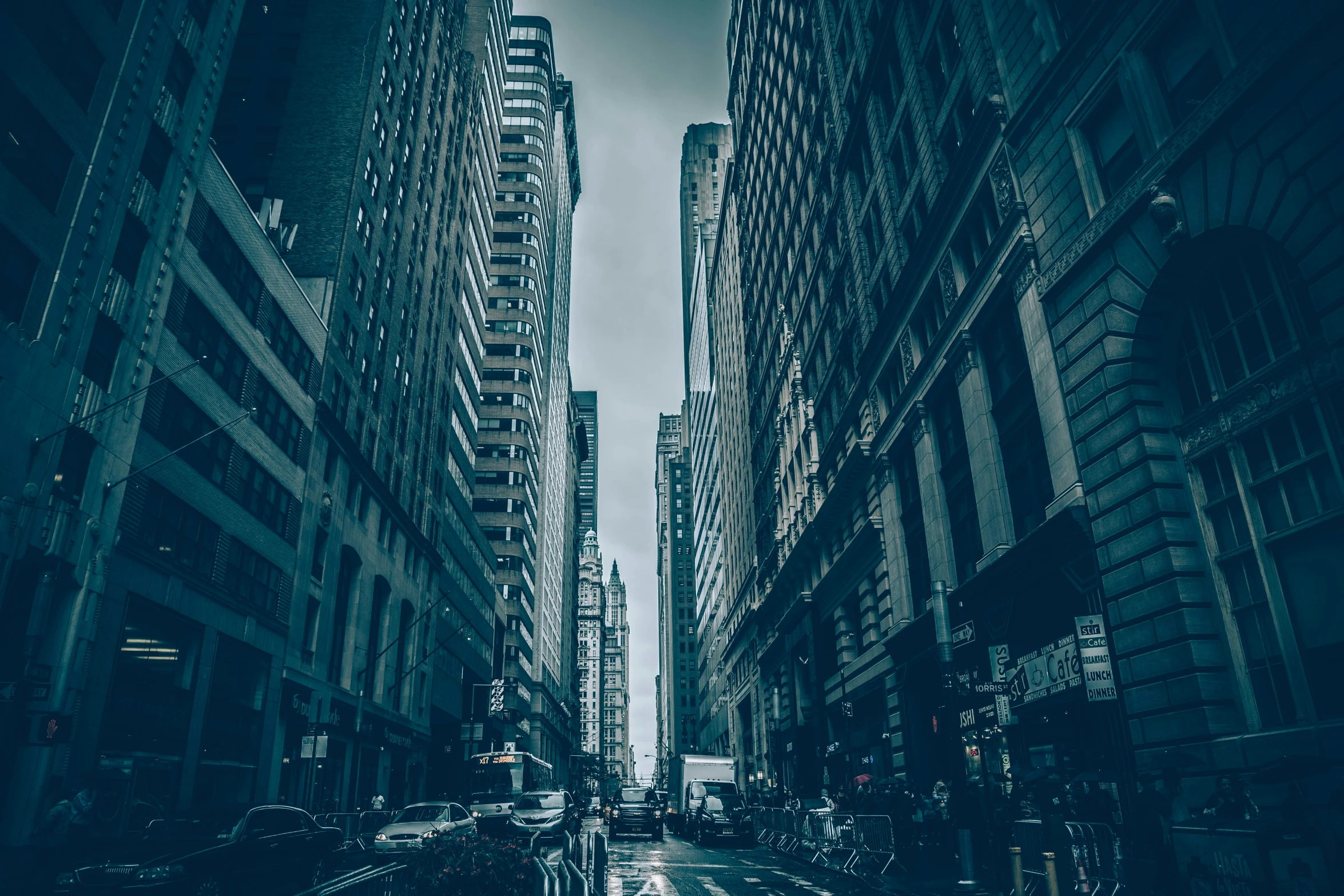 city traffic on a city street in the rain