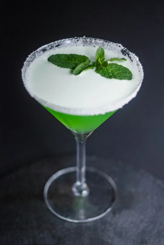 an image of green cocktail in the form of a martini glass