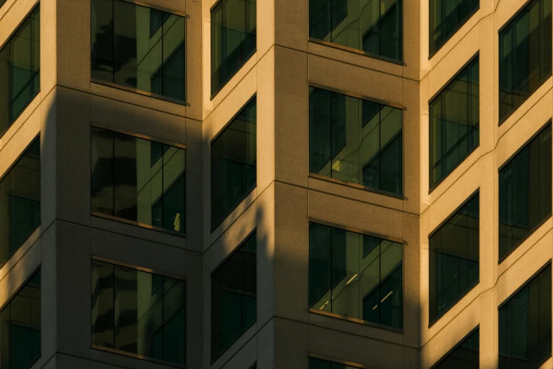 an airplane flying close to a building with large windows