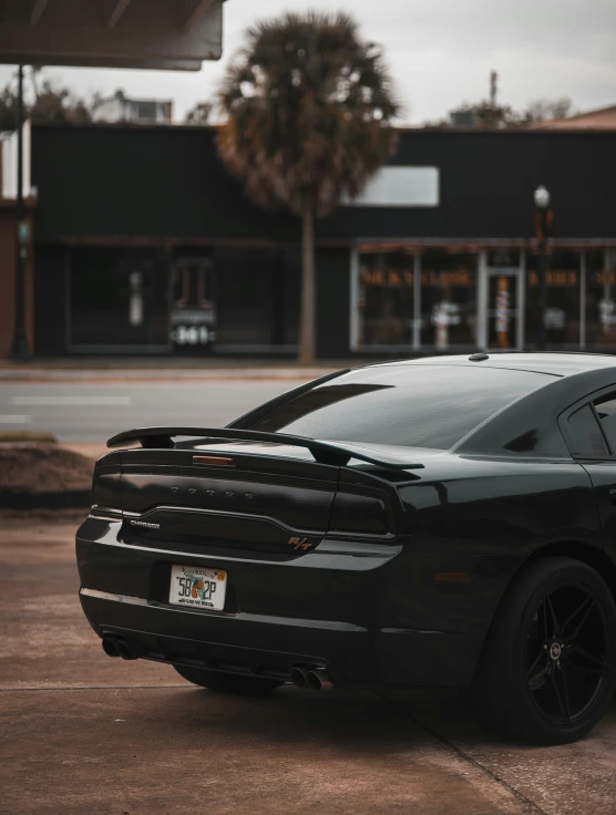 a car parked in the street by some buildings