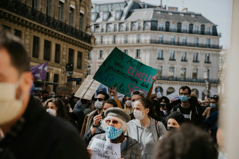 some people walking around and holding signs