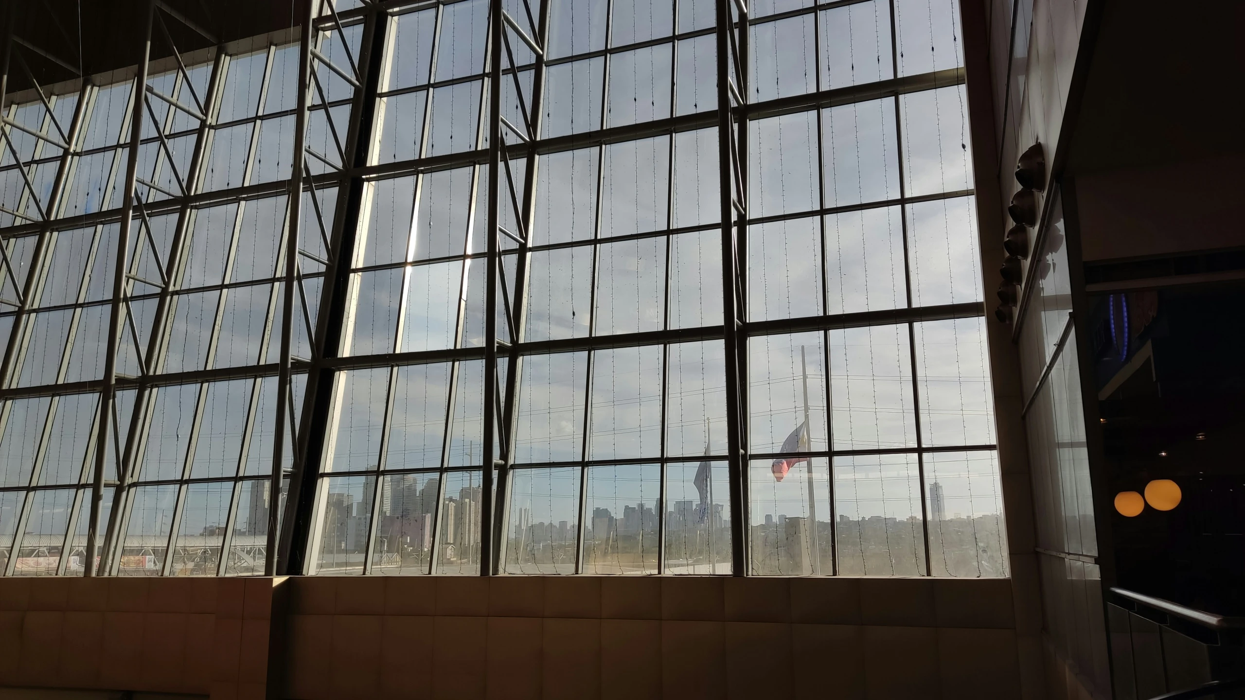 a very large window reflecting the sky above