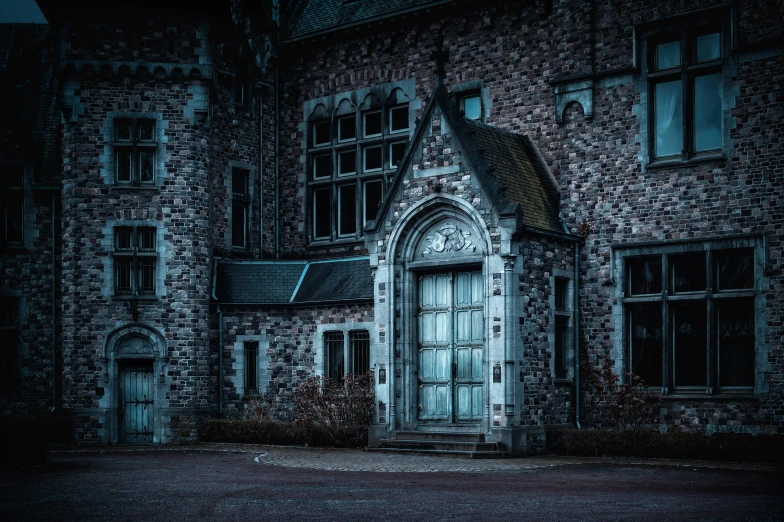 an old brick building that has been pographed in very dark lighting