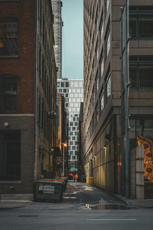 two cars are parked on the side of an empty city street