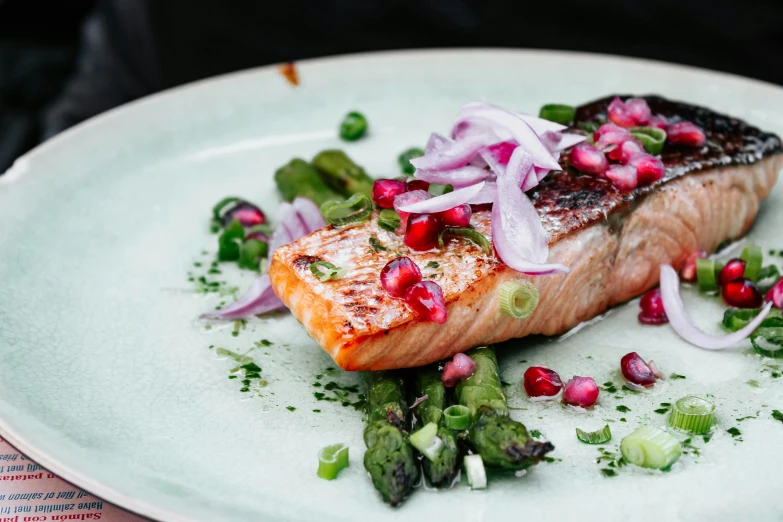 a white plate holding some kind of food with many other things around it