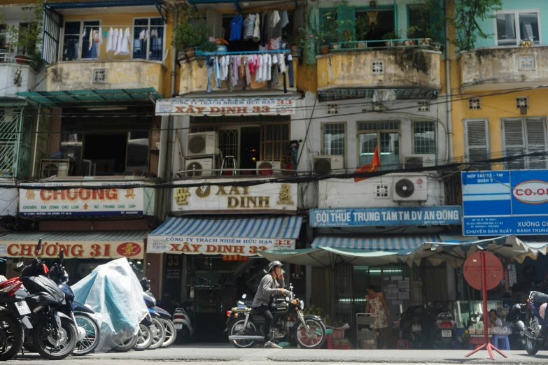 a group of motorcycles parked in front of several building