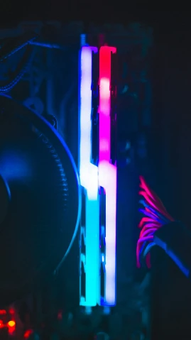 neon colored computer components lit up in the dark