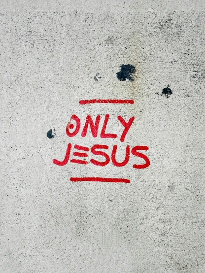 this sign appears to be only jesus painted on concrete