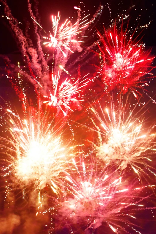 some colorful fireworks exploding on the night sky