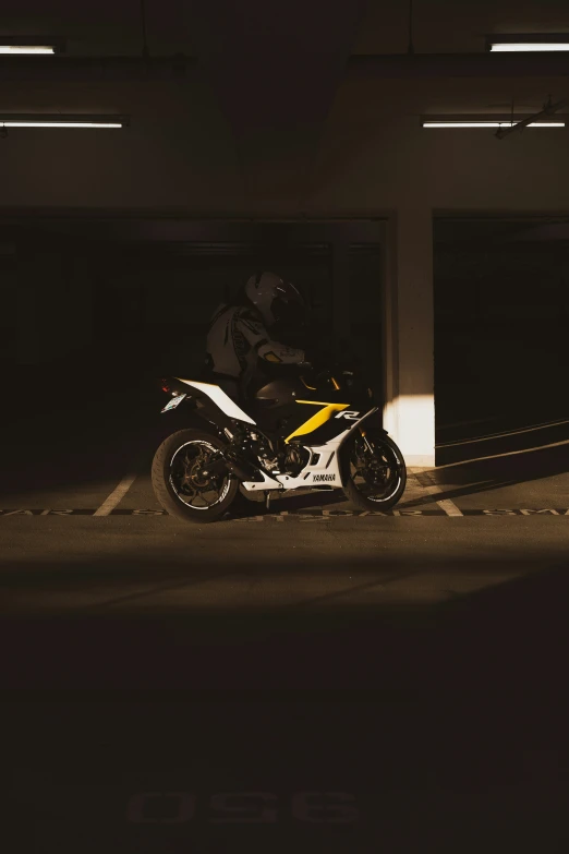 a motorcycle parked next to a couple of garage doors