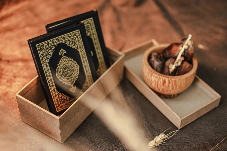 a box containing an old book and some food