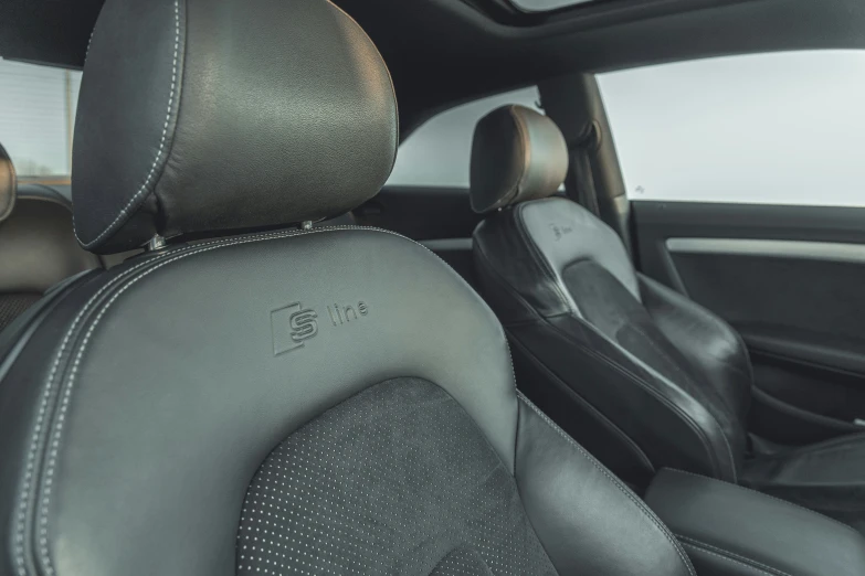 black seat cushion and steering wheel of a car