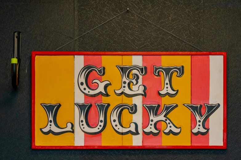 colorful striped sign that reads get lucky