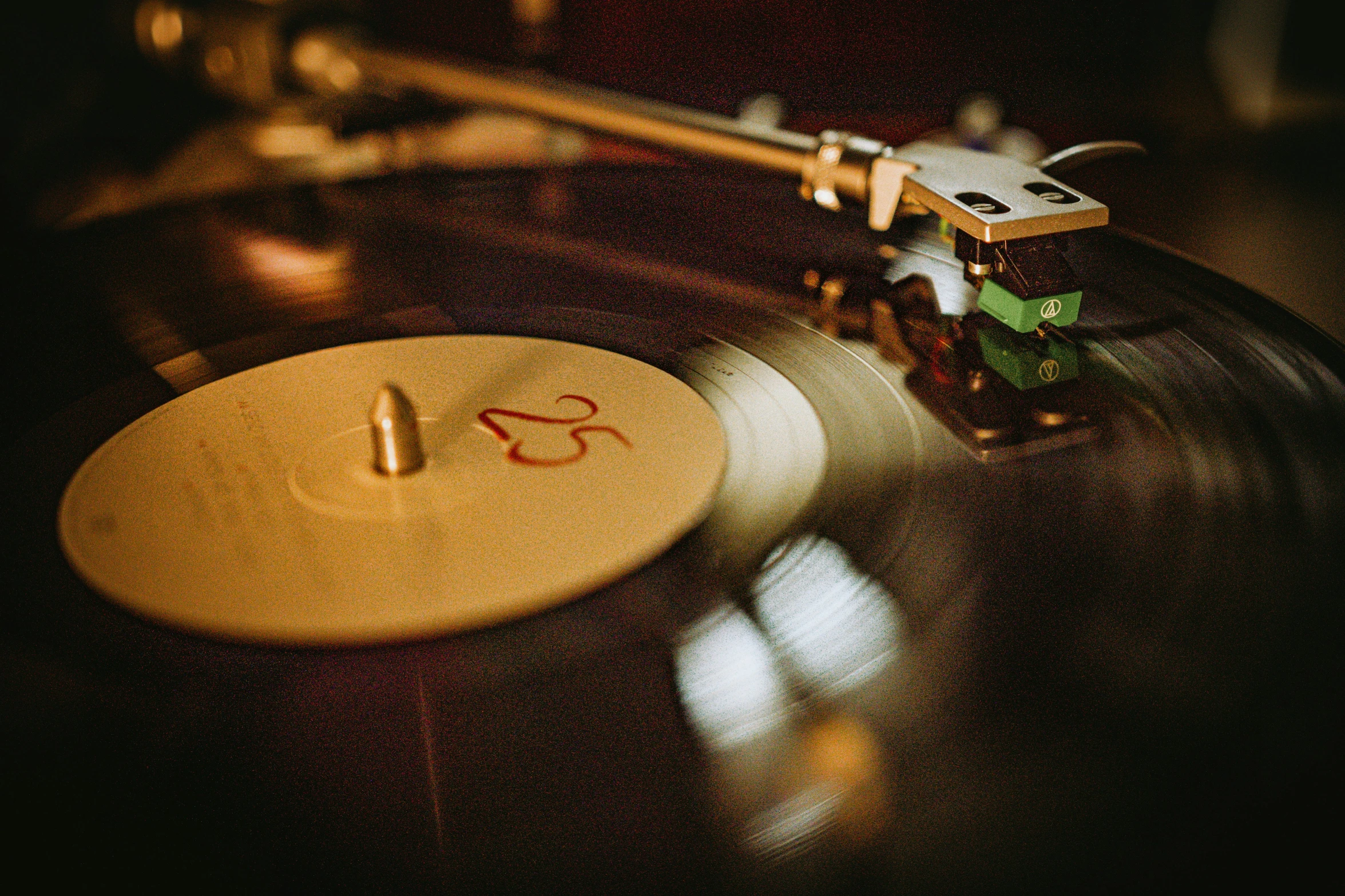 a music disc is on a table with other items