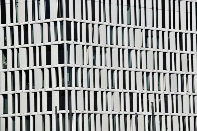 the building's wavy white window walls are in full perspective