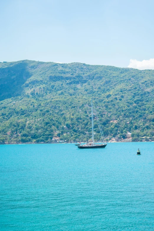 a large boat floating across a large body of water