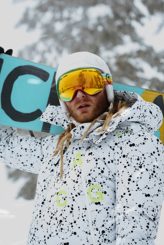 a man is holding his snow board behind his head