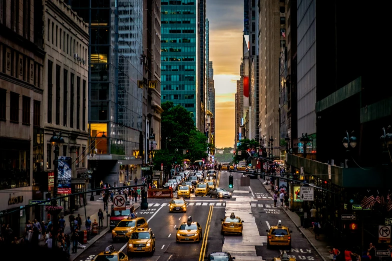 an aerial view of cars driving on a busy city street