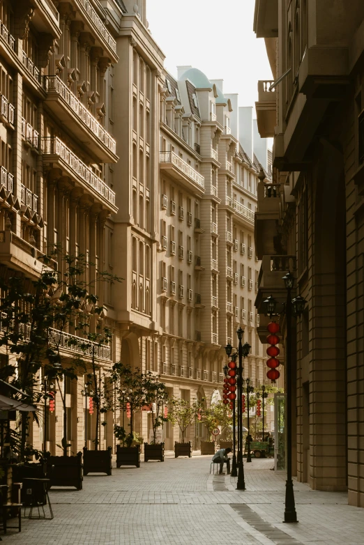 a cobblestone walkway leading to several buildings with balconies