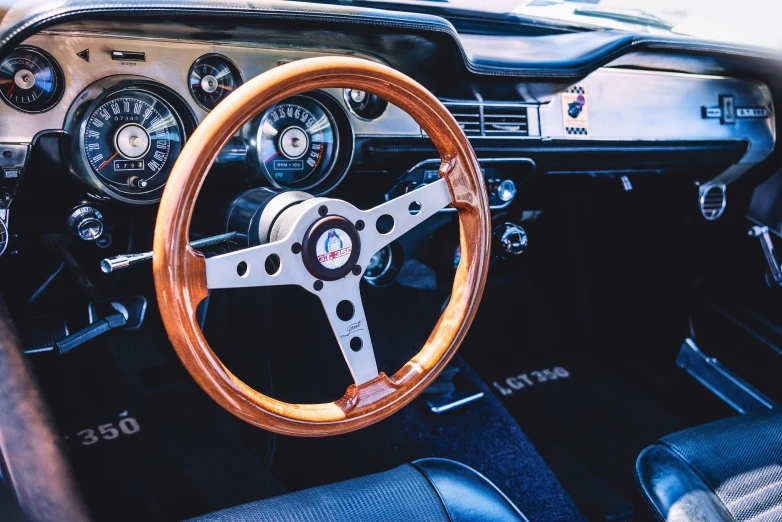 this is an old race car with steering wheel and dashboard