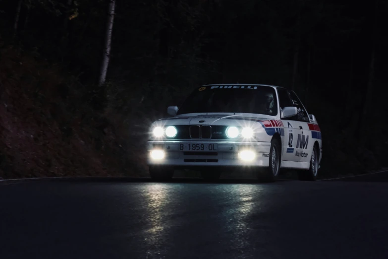 a white van driving down the road at night