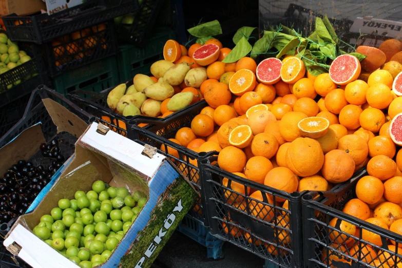 a bunch of boxes full of fresh fruit for sale