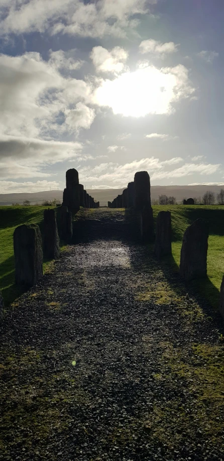 the sun shines in over an ancient cemetery