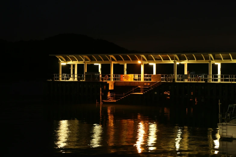 a boat floating on a river at night