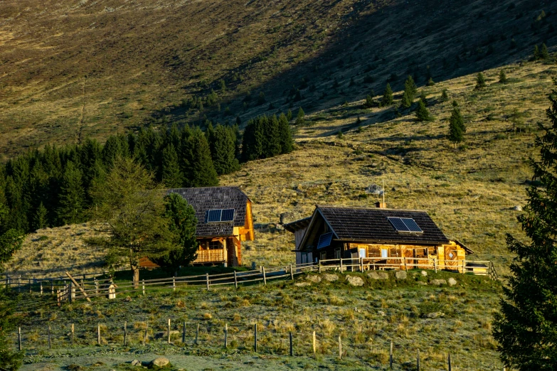 a small wooden cabin nestled in the middle of a field