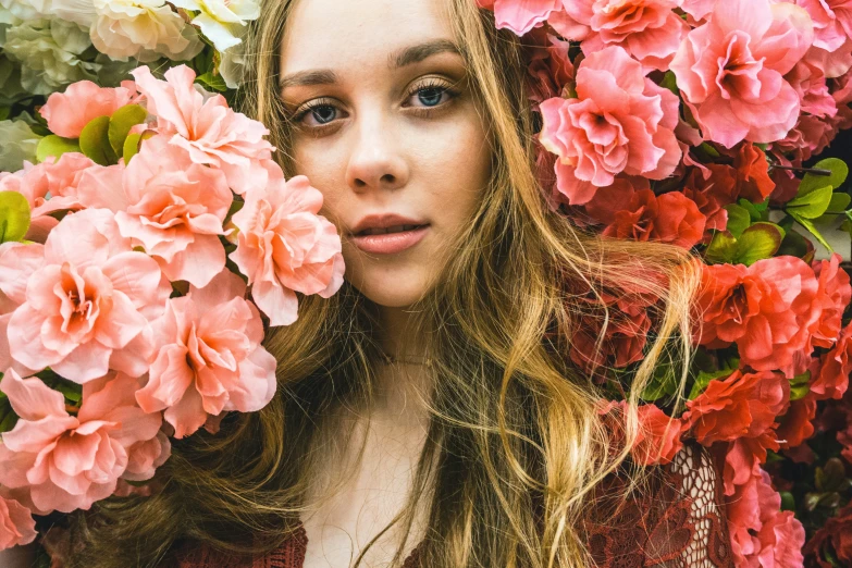 an image of a beautiful woman surrounded by flowers
