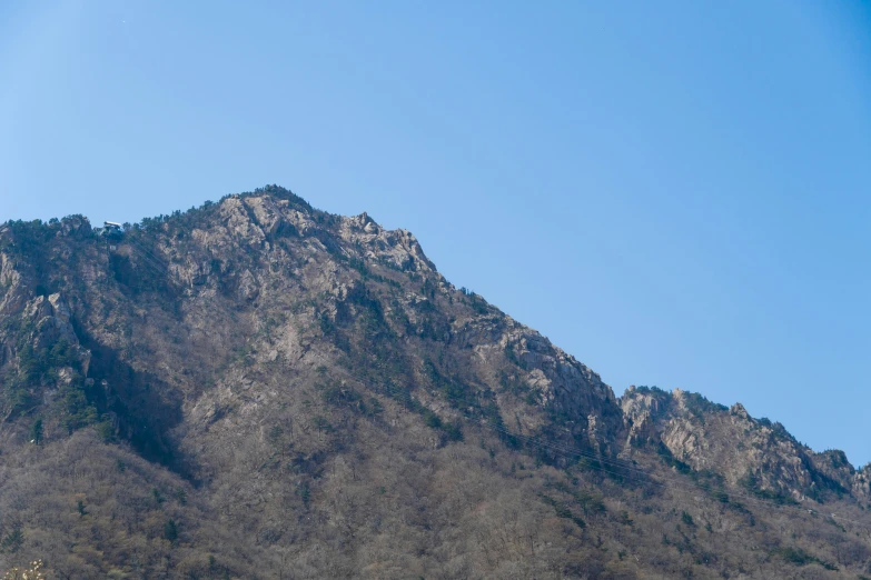 the top of a mountain against a blue sky