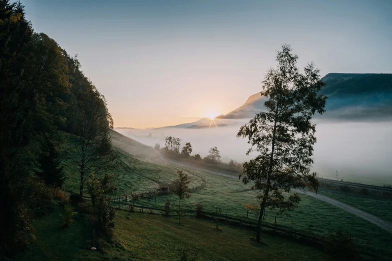 mist rolling over the hills in a beautiful sunrise