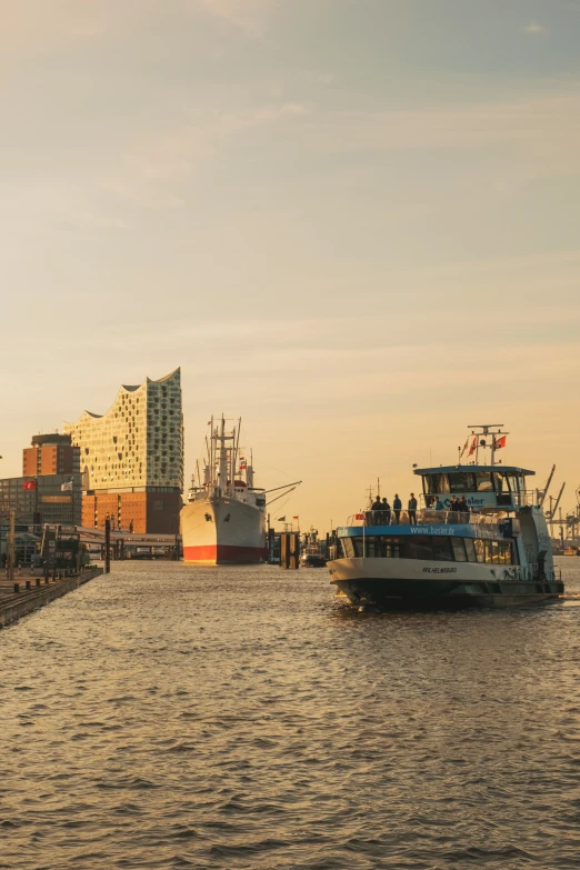 boats are anchored at a dock next to some buildings