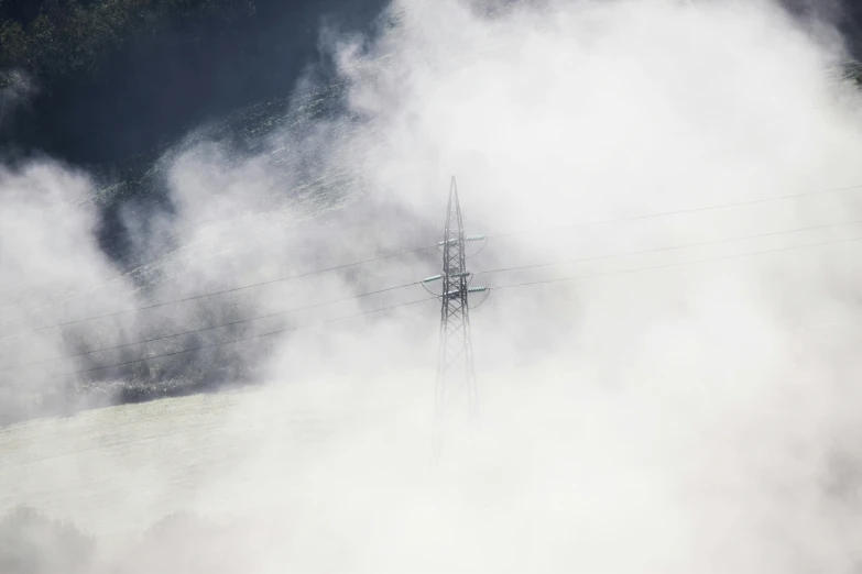 a large area with several telephone poles and clouds