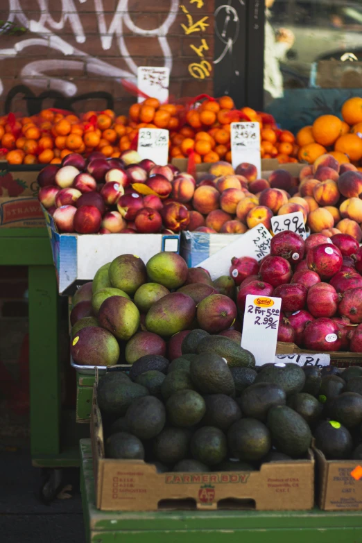 there is a market stall with assorted fruits on display