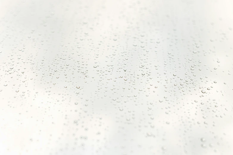 water drops hanging from the ceiling on the glass