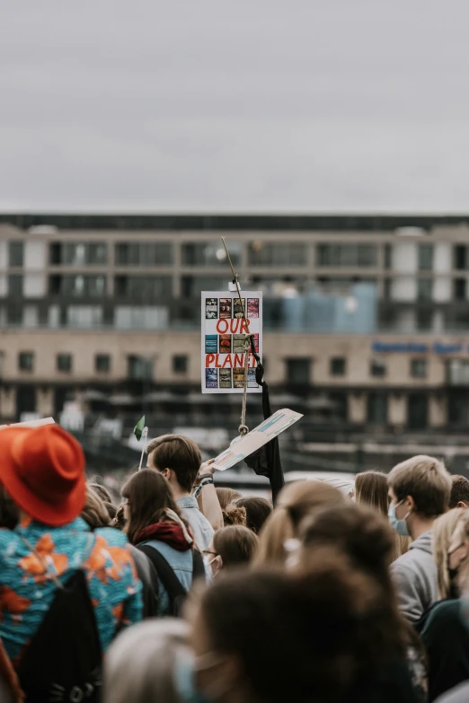 an image of a person holding a sign in the air