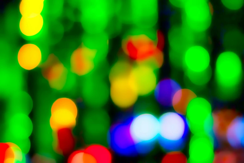 brightly colored lights are glowing brightly and blurry