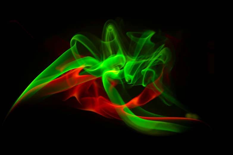 an abstract background of green and red smoke on a black background