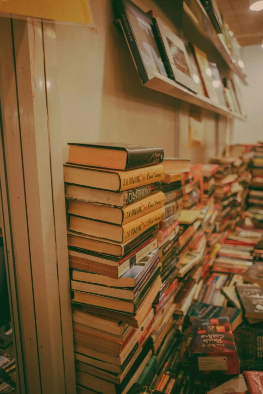 many books are stacked up in a row