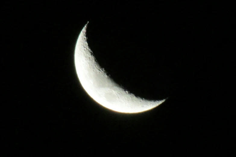 the moon is almost obscured by its dark outer half